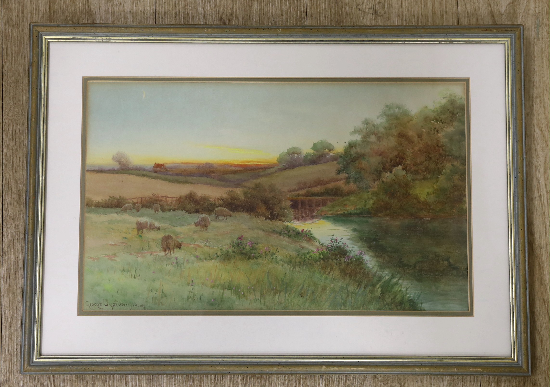 George Oyston (1861-1937), watercolour, Sheep in a meadow at sunset, signed and dated 1910, 26 x 44cm